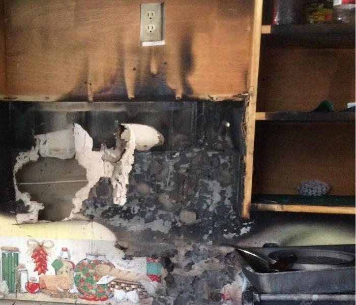 Fire damage to portion of household kitchen 