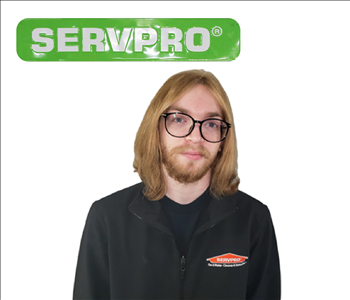 Male employee Chandler Wallace for SERVPRO photo on white wall