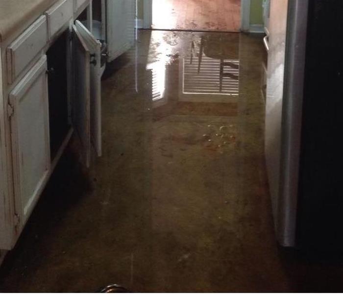 Kitchen floor experiencing flooding